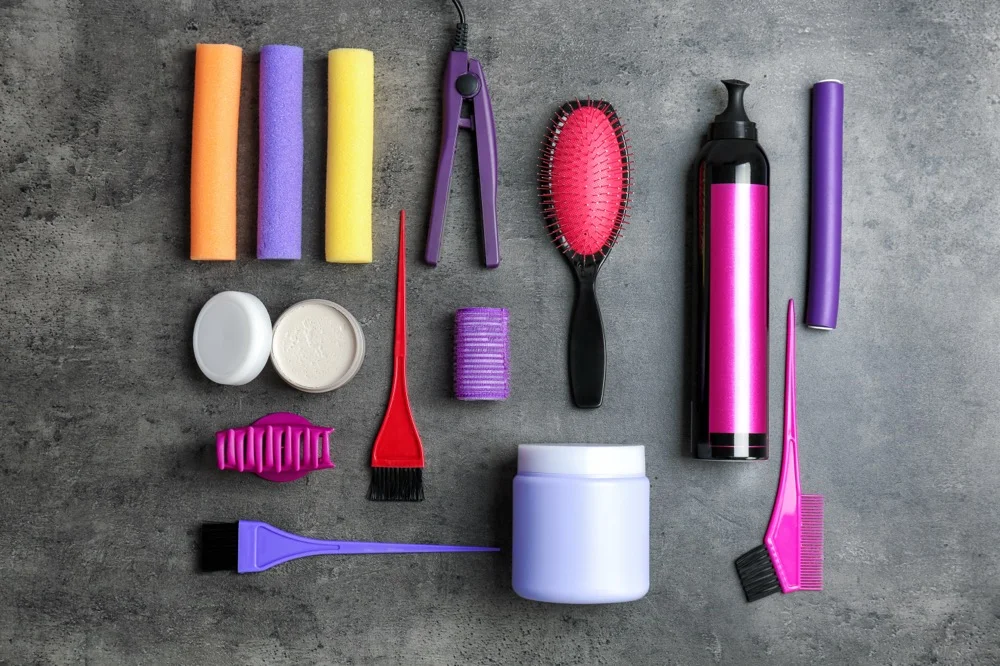 Keratin treatment products brush and flat iron on salon table