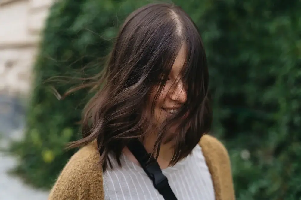 Curtain bangs hairstyle with soft face-framing layers for spring 2026
