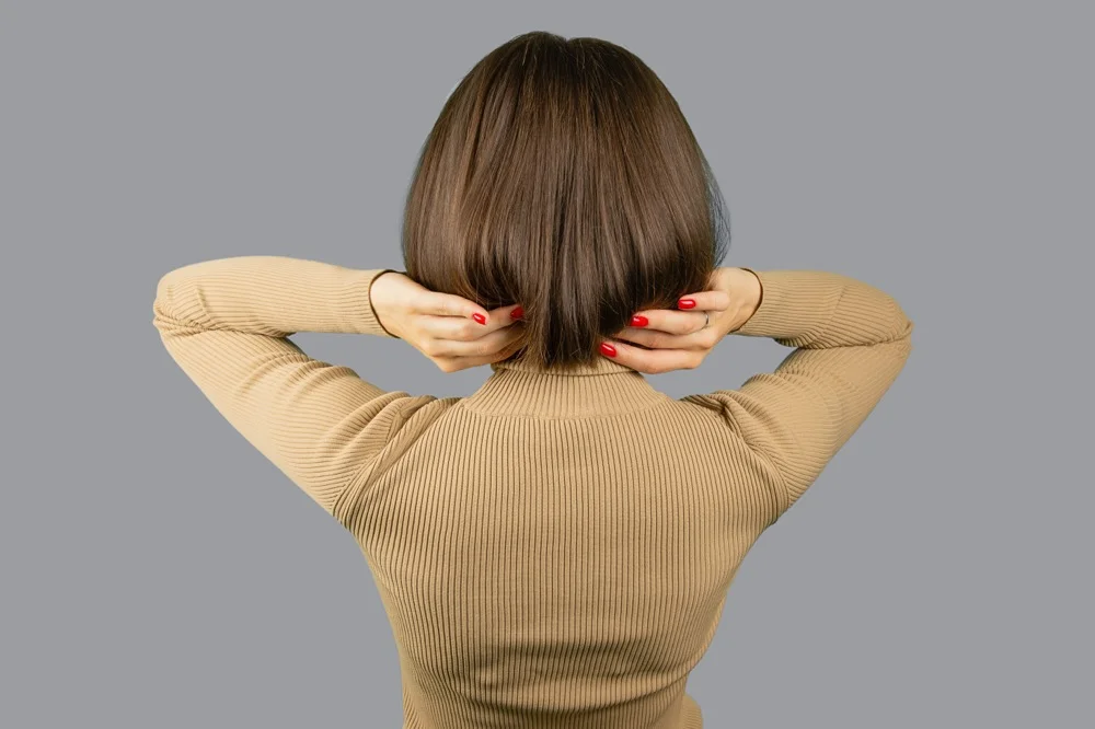 Woman with soft airy bob haircut featuring blended layers and natural movement